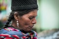 Unidentified indigenous native Quechua woman with traditional tribal clothing and hat, at the Tarabuco Sunday Market, Bolivia